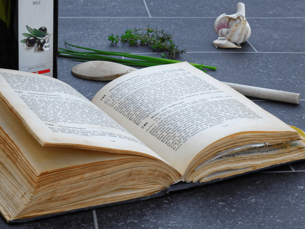 a vintage cookbook sitting open on a counter