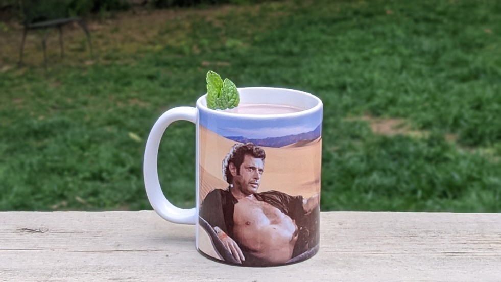 mint hot chocolate in a mug with a photo of Jeff Goldblum on it